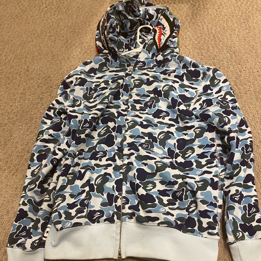 Bape Blue Camo Hoodie (Authentic)the ape head is under the Xl